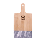 Moravian University black marble and bamboo cutting board with small brown logo near handle