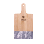 Regis University black marble and bamboo cutting board with small brown logo near handle