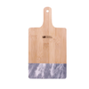 Western Seminary black marble and bamboo cutting board with small brown logo near handle